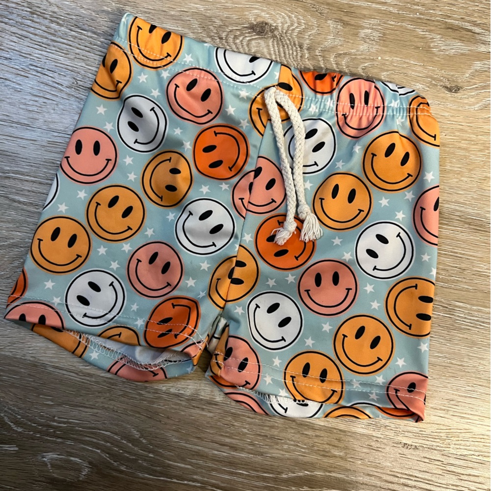 Smiley face swim trunks